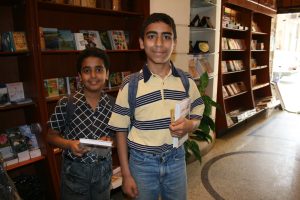 Two boys with Scriptures they have purchased in the Minya bookshop.